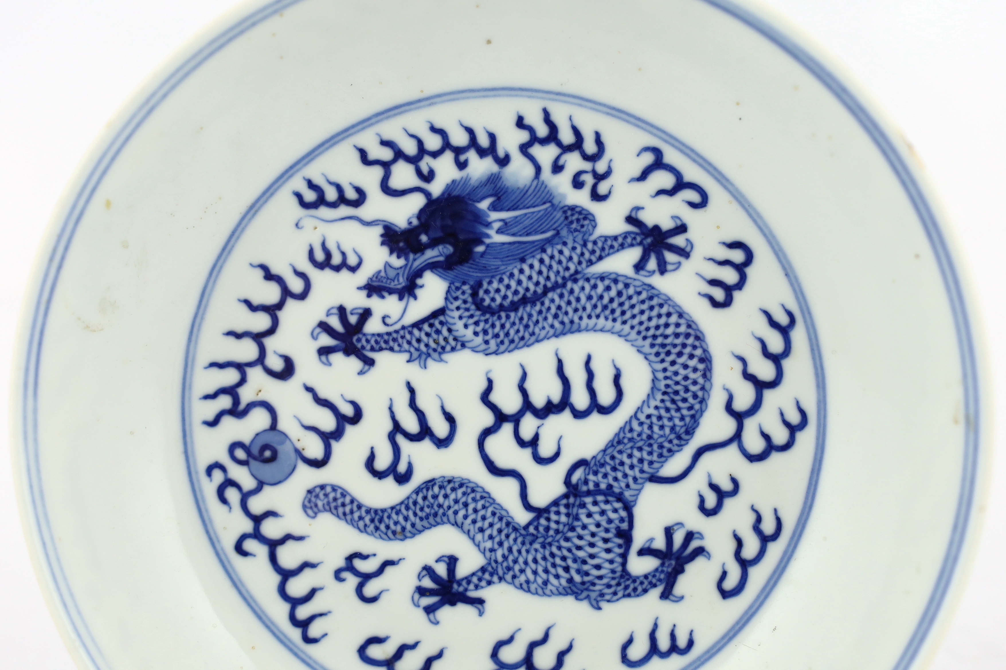A Chinese blue and white ‘dragon’ dish, Guangxu mark and of the period (1875-1908), tiny glaze chip to rim